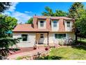 Inviting home featuring a cozy front porch and manicured landscaping at 1813 Pikes Peak St, Erie, CO 80516