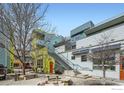 Modern multi-story condo building shows unique architectural design and shared outdoor space at 2018 Ionosphere St # 3, Longmont, CO 80504