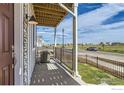A covered porch showing exterior finishes and neighborhood views at 2770 Bear Springs Cir, Longmont, CO 80503