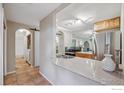 Open concept kitchen with stainless steel appliances, granite countertops, and adjacent laundry and bathroom at 715 Arapahoe Ave # 2, Boulder, CO 80302