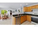 Functional kitchen with granite countertops, stainless steel appliances, and a bright breakfast nook at 903 Grays Peak Dr, Superior, CO 80027