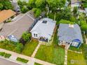 Birds eye view showcases a well-maintained home with a manicured lawn and neighborhood landscape at 1013 La Farge Ave, Louisville, CO 80027