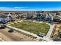 A vibrant community with a central park, showcasing lush greenery and well-maintained homes at 128 E Douglas St, Superior, CO 80027