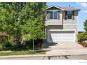 Charming two-story home with a two-car garage at 166 Monares Ln, Erie, CO 80516