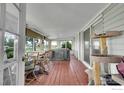 Cozy sun room with hot tub, rustic wood floors and windows overlooking the outdoors at 18247 County Road 22, Fort Lupton, CO 80621