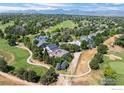 Panoramic aerial shot showcases home's location on a golf course with mountain views in the distance at 2975 Thunder Lake Cir, Lafayette, CO 80026
