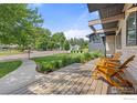 Relaxing porch with wood flooring and comfortable seating for enjoying the neighborhood view at 3863 57Th St, Boulder, CO 80301
