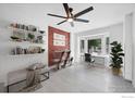 Bright home office with large bay window, white tiled floors, and decorative shelving at 6755 W 33Rd Ave, Wheat Ridge, CO 80033