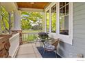 Relaxing porch with outdoor seating area, perfect for enjoying the beautiful views at 1231 Hawk Ridge Rd, Lafayette, CO 80026