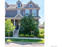 Attractive townhome with well-maintained landscaping, a charming porch, and a welcoming exterior at 1668 Saratoga Dr, Lafayette, CO 80026