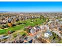 Gray two-story home near a golf course, circled in red with panoramic views and clear blue skies at 2765 Meadow Mountain Trl, Lafayette, CO 80026