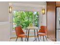 Cozy breakfast nook with sunny window views, modern lighting, and seating for two at 400 Lois Dr, Louisville, CO 80027
