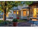 Charming backyard patio with dining table, perfect for outdoor entertaining at 505 Orchard Dr, Louisville, CO 80027