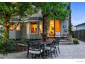 Charming outdoor patio with a dining table and chairs, perfect for al fresco dining at 505 Orchard Dr, Louisville, CO 80027