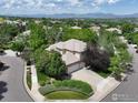 Expansive aerial view showcasing a home with lush landscaping in a desirable neighborhood at 11433 Decatur Ct, Westminster, CO 80234