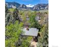 This property has beautiful mountain views and mature trees at 1245 Claremont Dr, Boulder, CO 80305