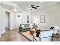 Comfortable living room with modern furnishings and hardwood floors at 1550 Harebell St, Berthoud, CO 80513