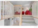 Bright entryway with staircase leading to an open living space with neutral tones and views of the living room at 2042 Garfield Ave, Louisville, CO 80027