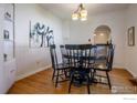 Charming dining room with hardwood floors and stylish lighting fixtures at 403 W Cannon St, Lafayette, CO 80026
