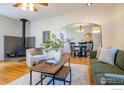 Inviting living room with a cozy fireplace, wood floors, and comfortable seating at 403 W Cannon St, Lafayette, CO 80026