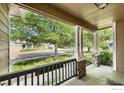 Inviting porch with stone supports and a view of the neighborhood at 669 Timothy Dr, Longmont, CO 80503