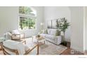 Inviting living room with oversized window and comfortable seating arrangement at 6838 Bugle Ct, Boulder, CO 80301