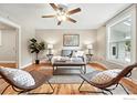 Inviting living room featuring hardwood floors, stylish furniture, and ample natural light at 1202 9Th Ave, Longmont, CO 80501