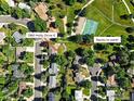 Stunning aerial view of the property backing to a lush park with mature trees at 1380 Holly Drive E at 1380 Holly E Dr, Broomfield, CO 80020