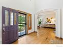 Bright foyer features hardwood floors, stylish front door and an open floor plan at 14601 Akron St, Brighton, CO 80602