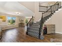 Spacious foyer features hardwood floors, staircase, and lots of natural light at 1485 Eversole Dr, Broomfield, CO 80023