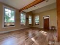 Bright living room with hardwood floors, exposed beam, and an abundance of natural light at 2204 Pine St, Boulder, CO 80302