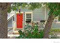 Inviting front porch framed by mature trees, offering a tranquil entryway to the home at 2205 Arapahoe Ave # 3, Boulder, CO 80302