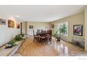 Open dining room with hardwood floors and natural light at 2513 Lanyon Dr, Longmont, CO 80503