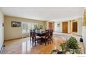 Spacious dining room with hardwood floors and large windows at 2513 Lanyon Dr, Longmont, CO 80503