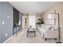 Comfortable living room with neutral walls, plush carpet, stylish decor, and lots of natural light at 3009 Madison Ave # 317, Boulder, CO 80303