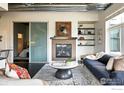 Cozy living room with fireplace, built-in shelving, and modern sliding glass door at 3401 Arapahoe Ave # 420, Boulder, CO 80303