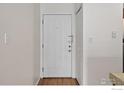 Interior entrance features a white door, light walls, and wood-look flooring at 3535 28Th St # 202, Boulder, CO 80301
