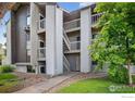 Apartment building exterior featuring multiple levels and walkways, nestled in a well-kept complex at 3535 28Th St # 202, Boulder, CO 80301