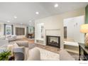 Bright living room with recessed lighting, fireplace and open floor plan at 40 Walter Way, Broomfield, CO 80020
