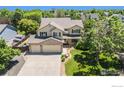 Beautiful two-story home featuring a manicured lawn and a spacious three car garage at 4804 Kingbird Dr, Frederick, CO 80504
