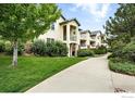 A view of the building's exteriors showcasing multiple units with quaint balconies and well-manicured lawns at 530 Mohawk Dr # 73, Boulder, CO 80303