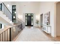 Bright and airy foyer with soaring ceilings, modern finishes, and a grand staircase at 640 Iris Ave, Boulder, CO 80304