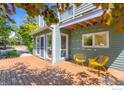 Inviting backyard deck with bright yellow chairs and natural light at 725 Union Ave, Boulder, CO 80304