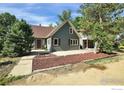 Charming home with a welcoming entrance and a well-manicured front yard at 10930 N 85Th St, Longmont, CO 80503