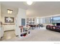 Open-concept living room featuring built-in shelving and expansive windows with mountain views at 1850 Folsom St # 706, Boulder, CO 80302
