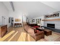 Inviting living room with a modern fireplace, hardwood floors, and comfortable seating at 37 Wagner Cir, Boulder, CO 80304