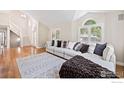 Spacious living room featuring hardwood floors, large windows, and a comfortable couch at 388 Fairfield Ln, Louisville, CO 80027