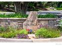 Stone sign for The Springs neighborhood with landscaping and decorative lighting at 388 Fairfield Ln, Louisville, CO 80027