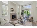 Living room with a fireplace and sliding door to a private patio at 4108 Riley Dr, Longmont, CO 80503