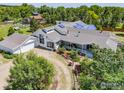 Aerial view of a stunning home with mature landscaping, a covered porch, and an attached garage at 4223 Eldorado Springs Dr, Boulder, CO 80303